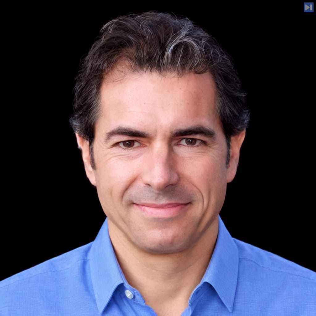 Head-and-shoulders portrait of Javier Garza against a black background.