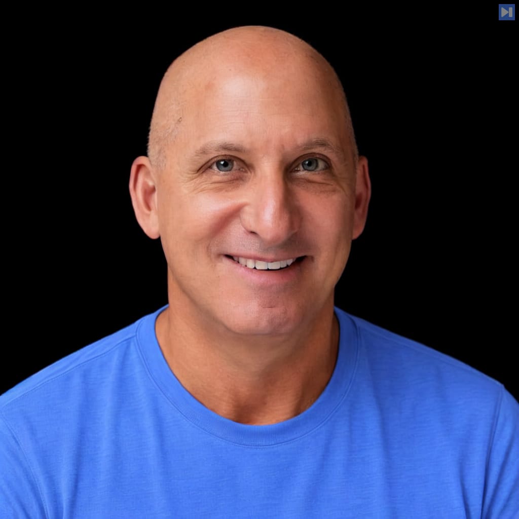 Head-and-shoulders portrait of Jeff Koss against a black background.