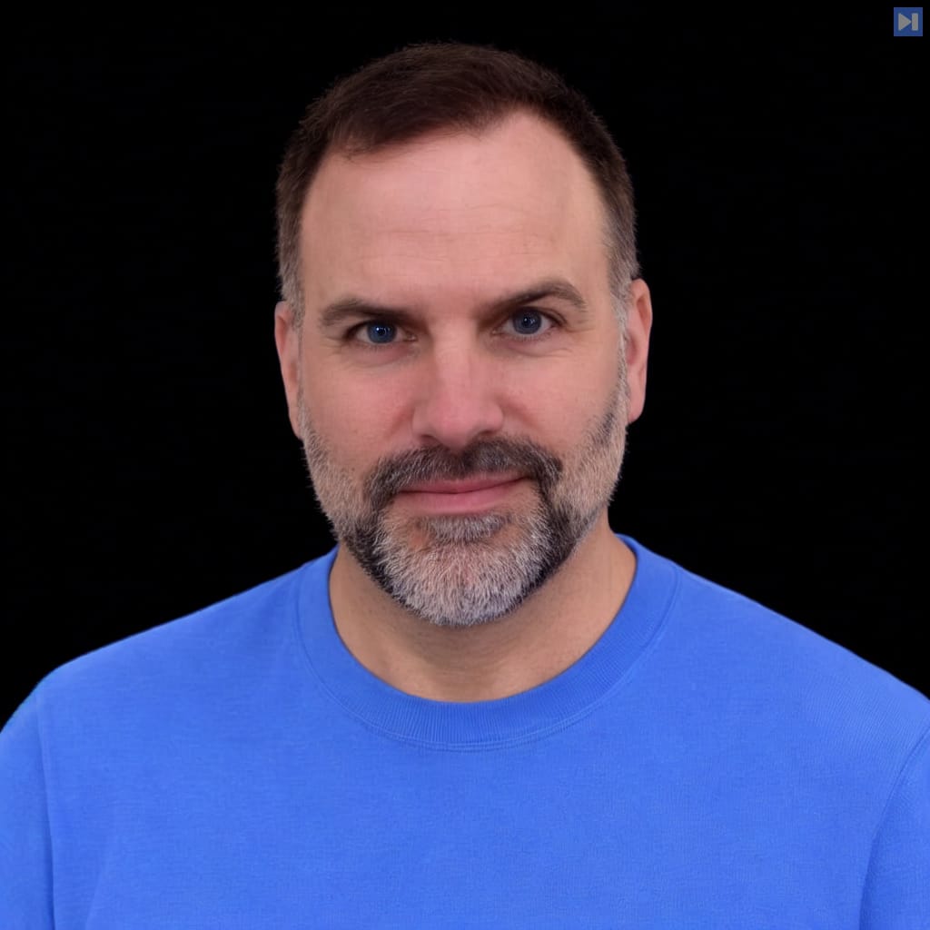 Head-and-shoulders portrait of Jeremy Adams - Casañas against a black background.