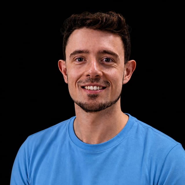 AI-generated portrait of Jérémy Scheurer wearing an AI Videos-blue top against a black background.