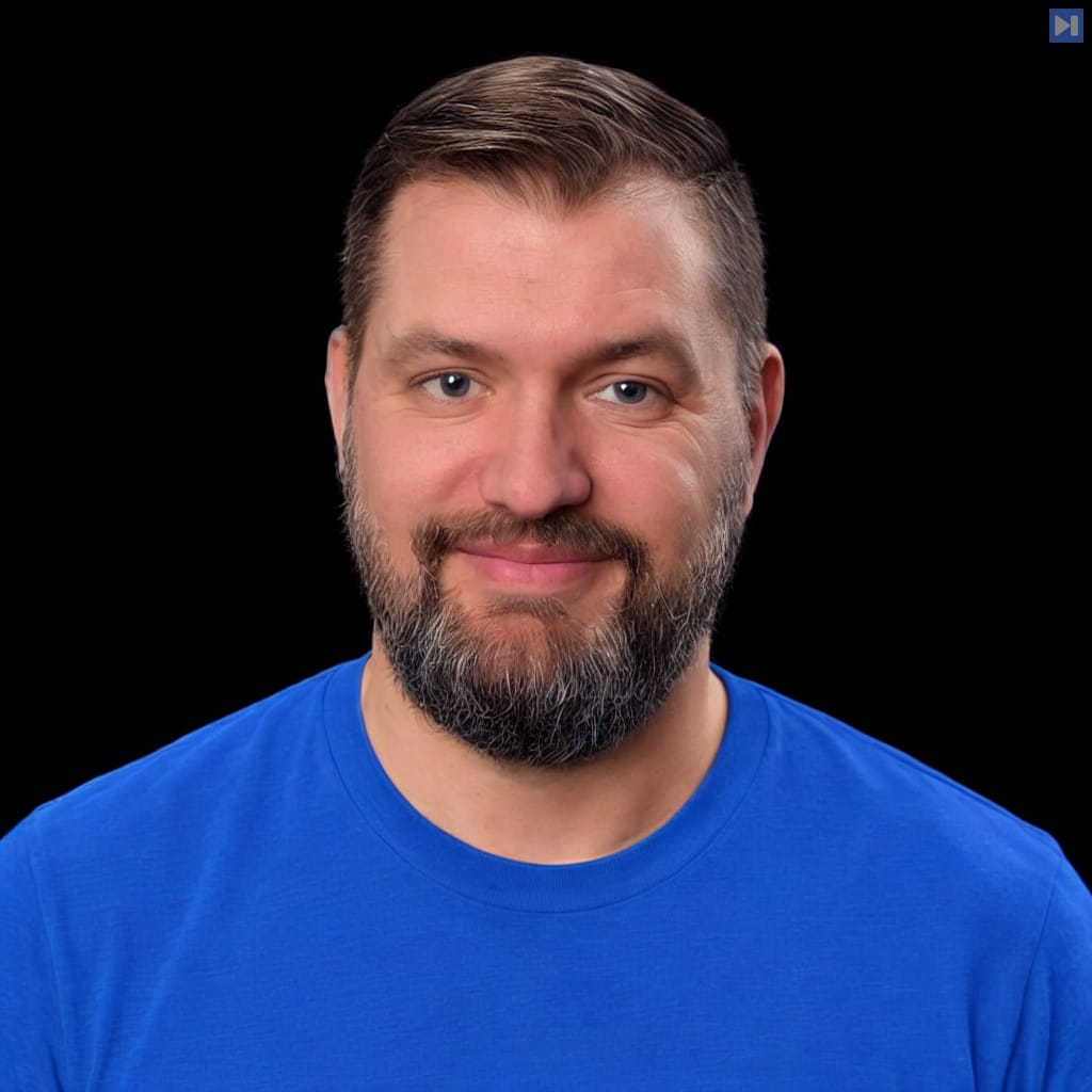 Head-and-shoulders portrait of Jesse Hall against a black background.