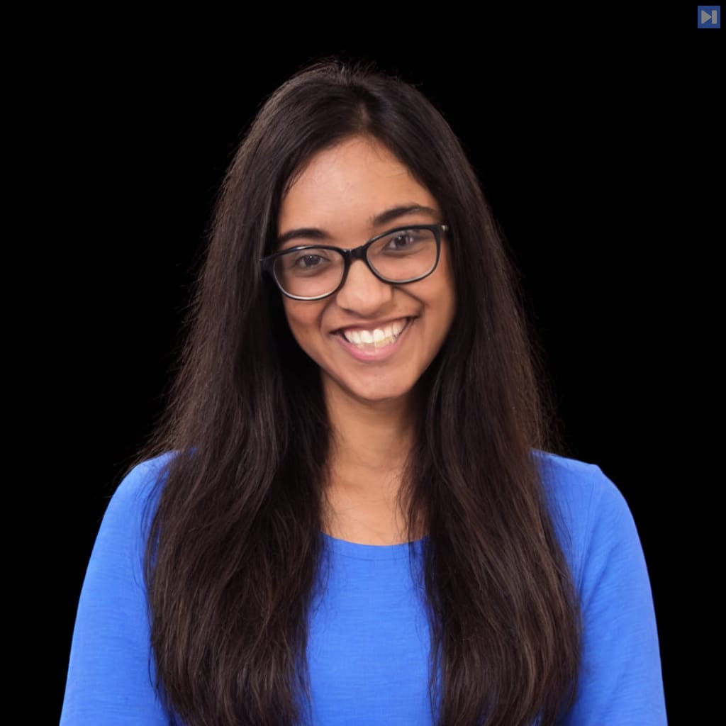Head-and-shoulders portrait of Jetashree Ravi against a black background.