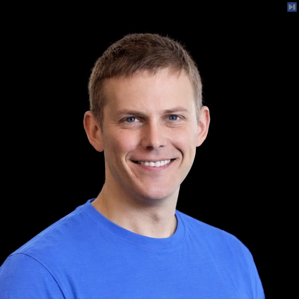 Head-and-shoulders portrait of Joe Gershenson against a black background.