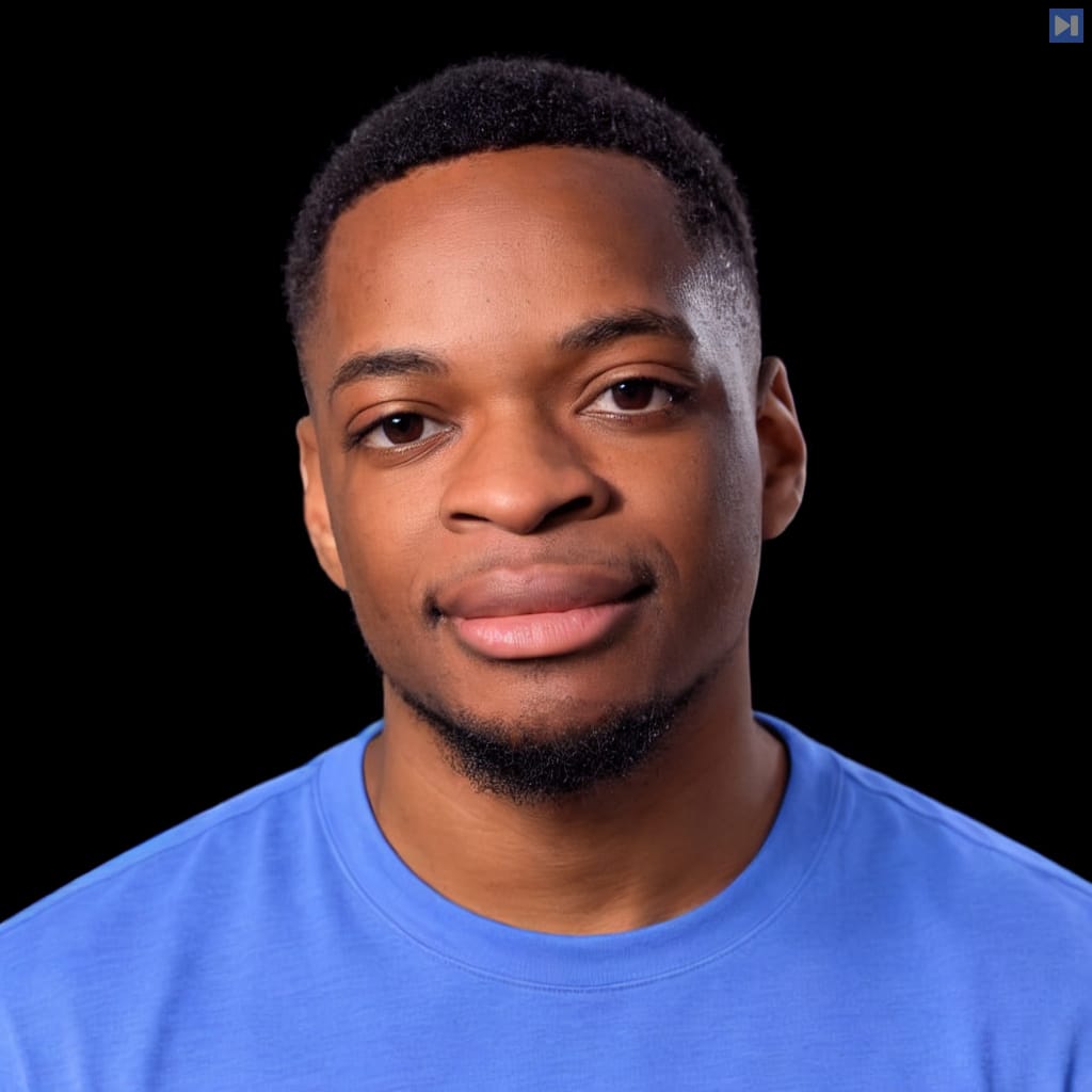 Head-and-shoulders portrait of Joel Allou against a black background.