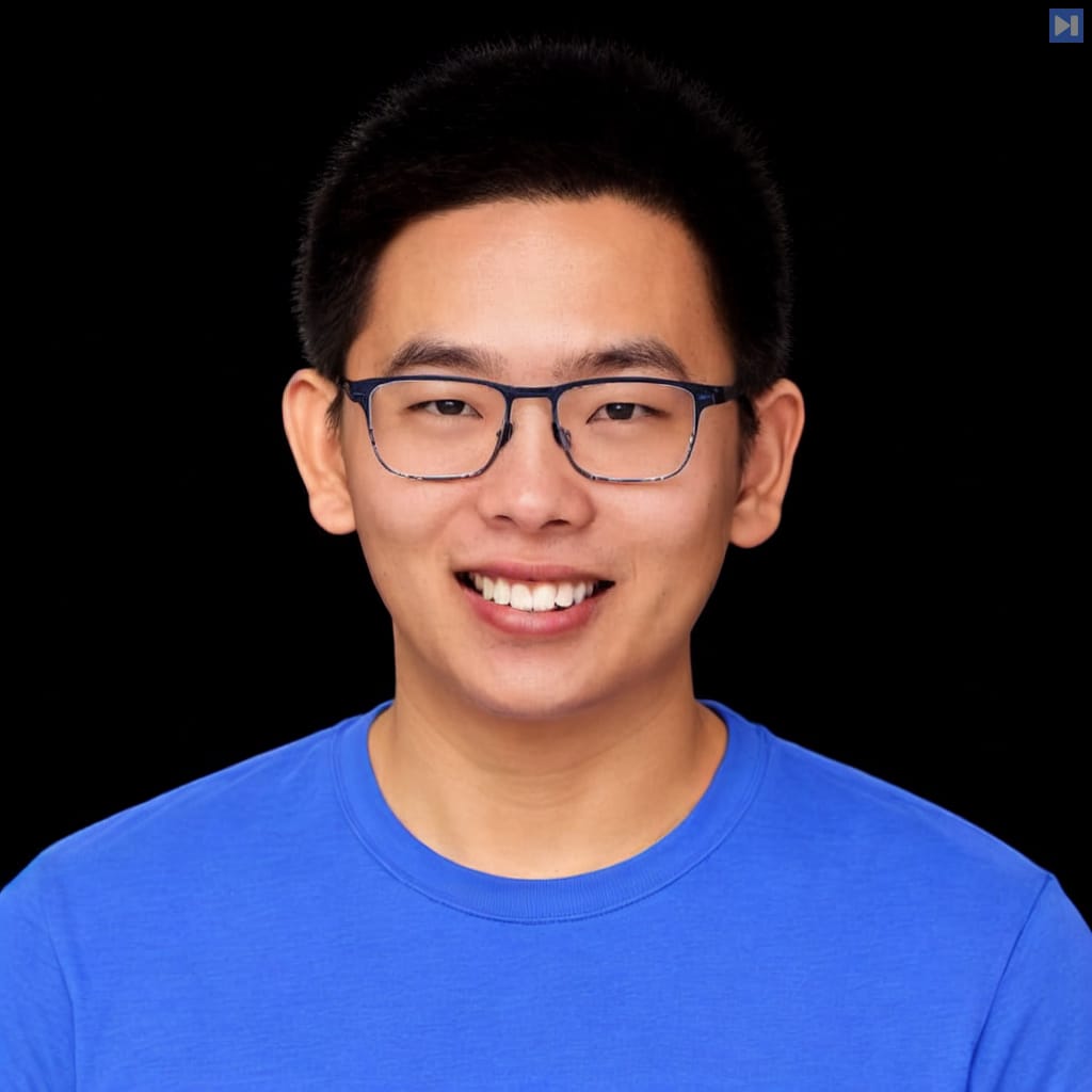 Head-and-shoulders portrait of Joseph Wang against a black background.