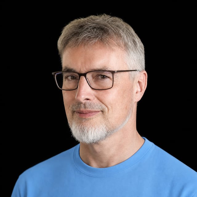 AI-generated portrait of Jürgen Schmidhuber wearing an AI Videos-blue top against a black background.