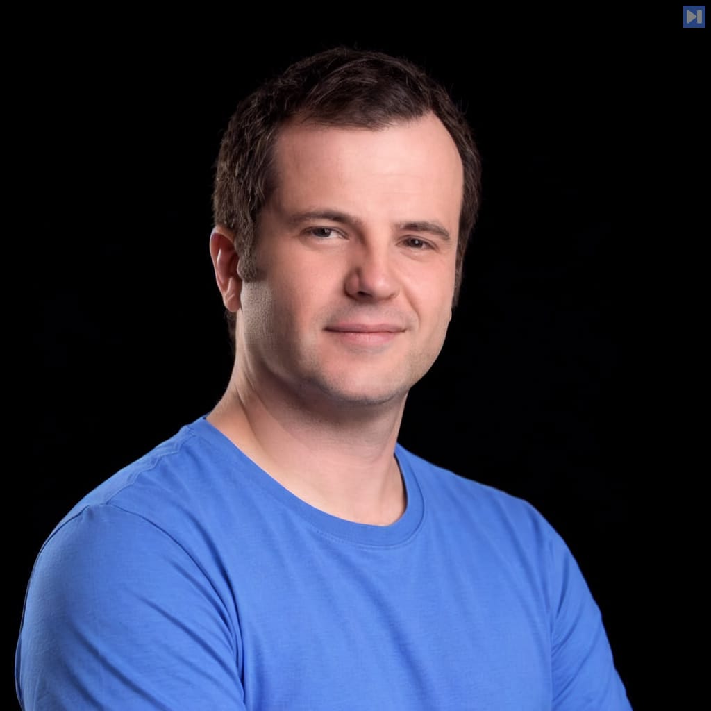 Head-and-shoulders portrait of Julien Chaumond against a black background.