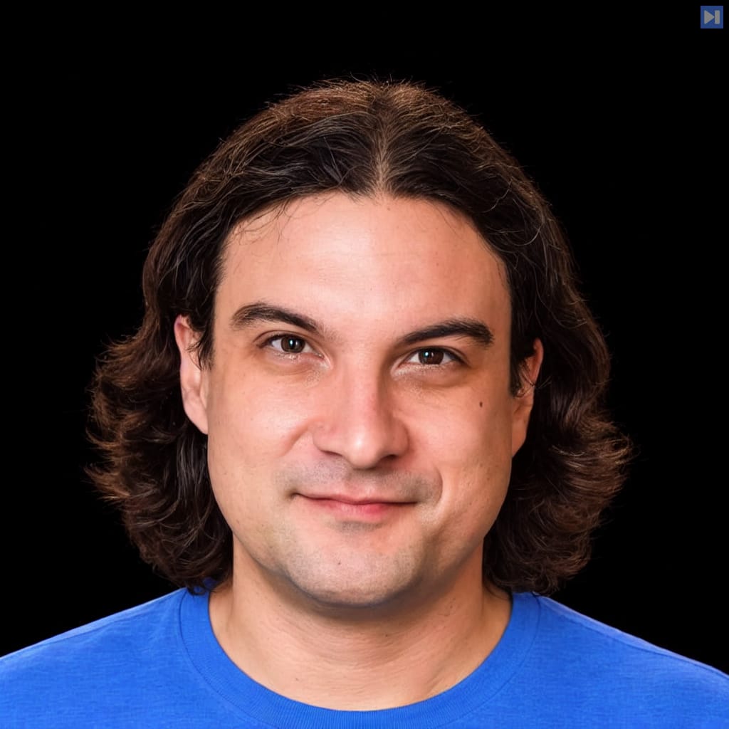 Head-and-shoulders portrait of Justin Reock against a black background.