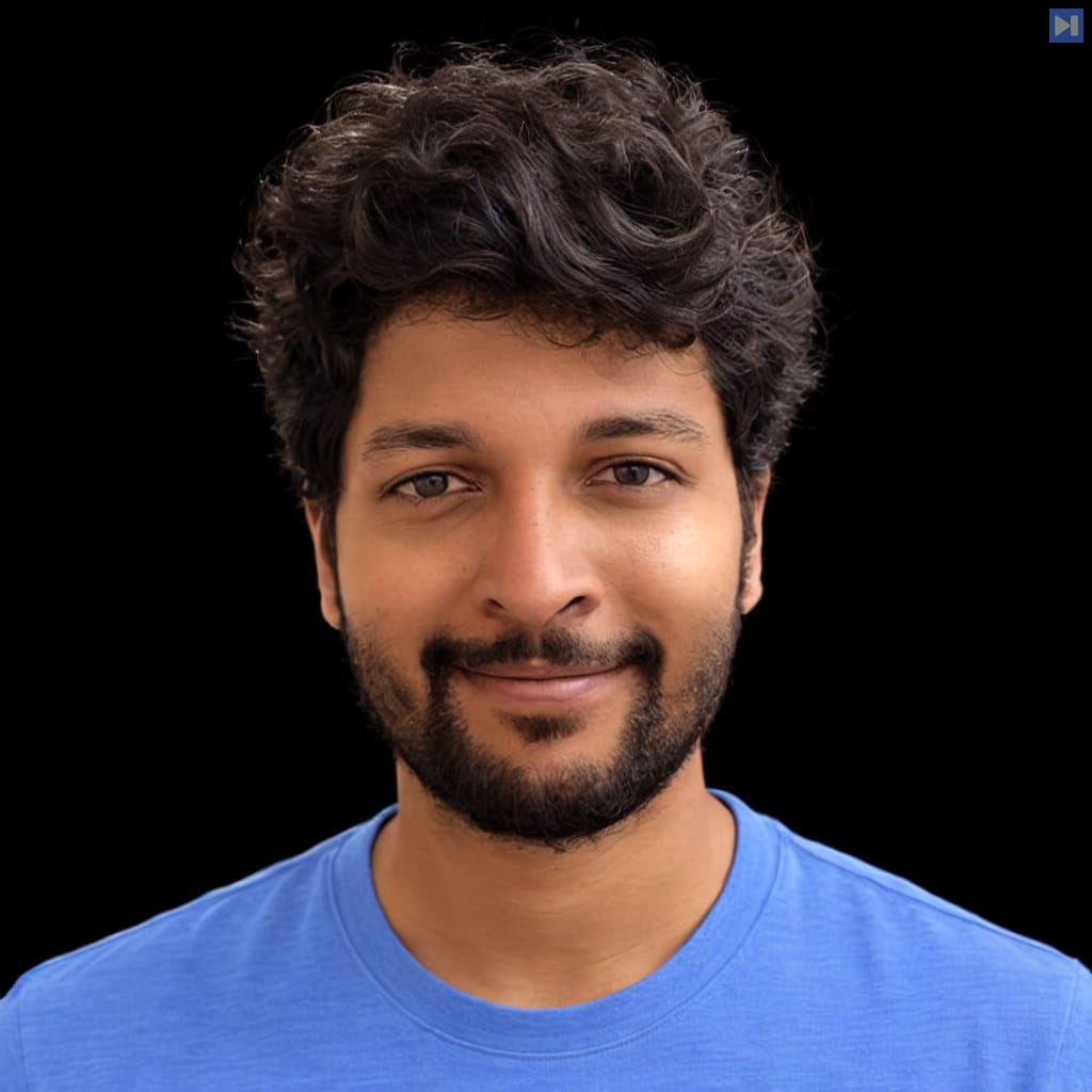 Head-and-shoulders portrait of Ketan Ramakrishnan against a black background.