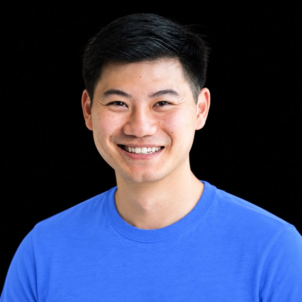 Head-and-shoulders portrait of Kevin Hou against a black background.