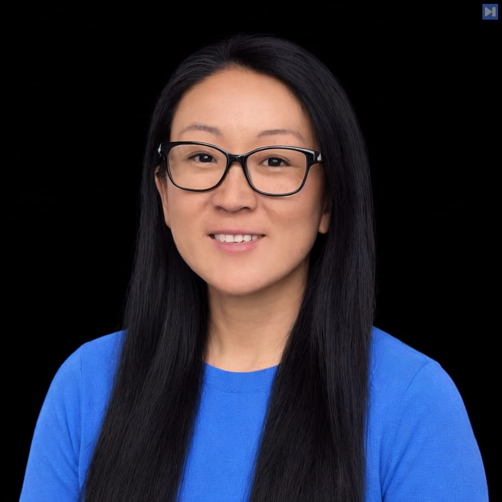 Head-and-shoulders portrait of Kim Maida against a black background.