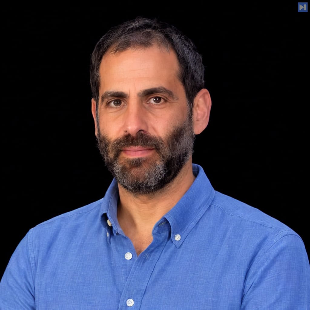 Head-and-shoulders portrait of Liad Yosef against a black background.