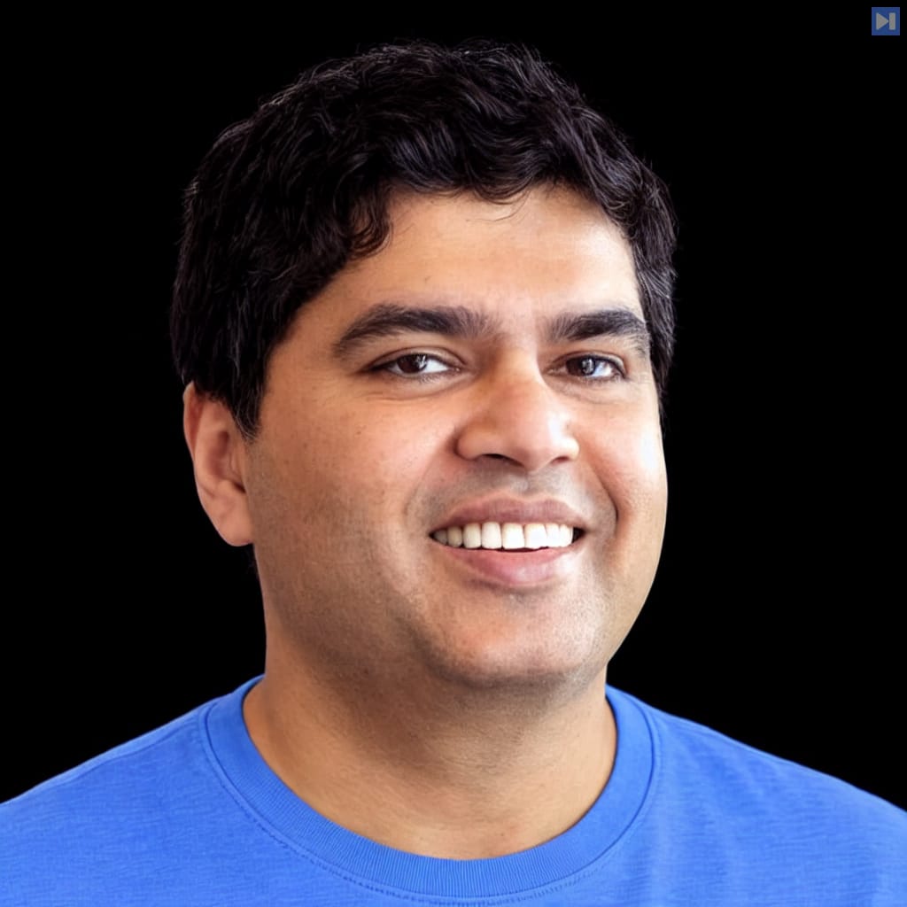 Head-and-shoulders portrait of Manoj Nair against a black background.