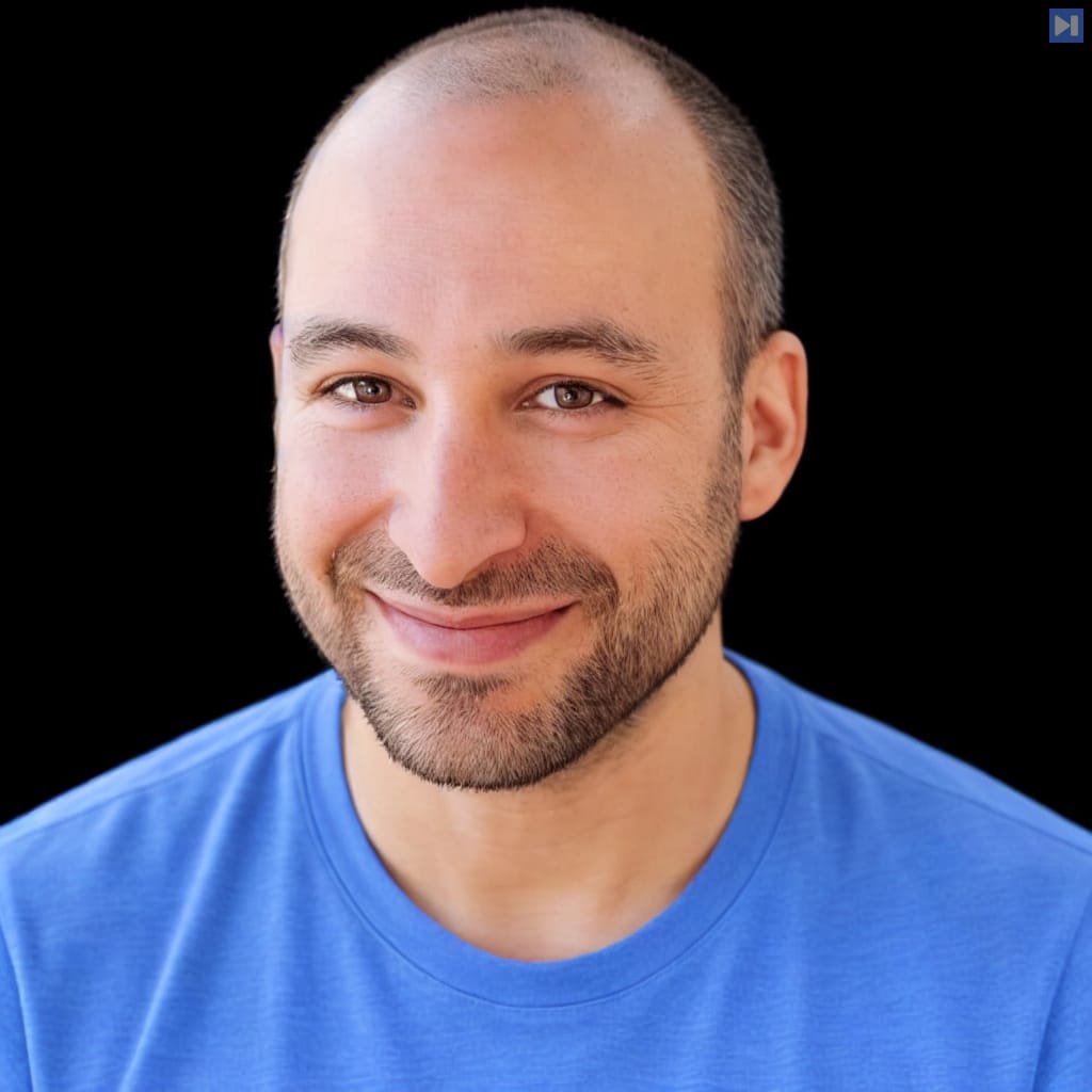 Head-and-shoulders portrait of Matt Brockman against a black background.