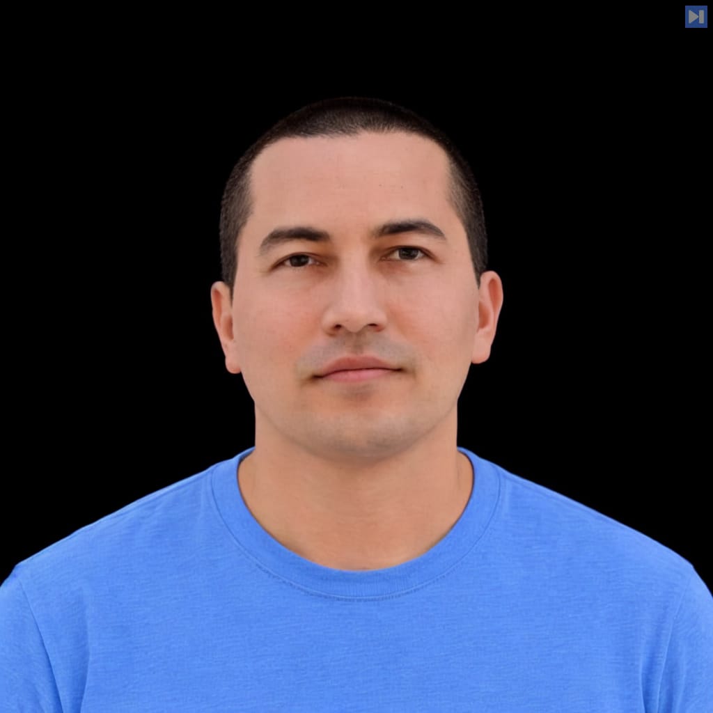 Head-and-shoulders portrait of Mitchell Hashimoto against a black background.