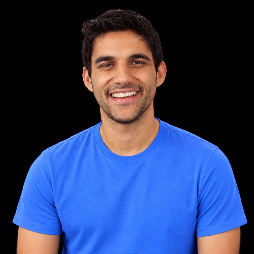 Head-and-shoulders portrait of Nikhil Benesch against a black background.
