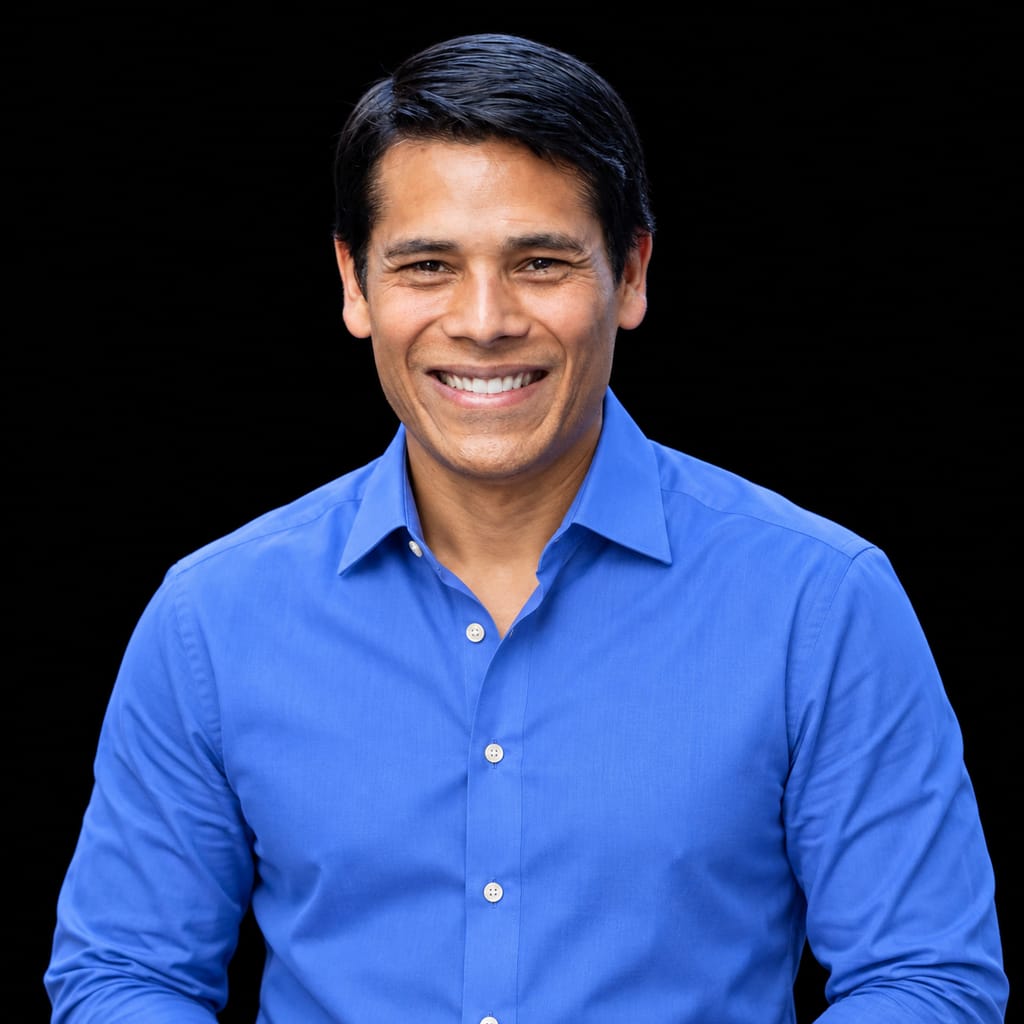 Head-and-shoulders portrait of Nirav Tolia against a black background.