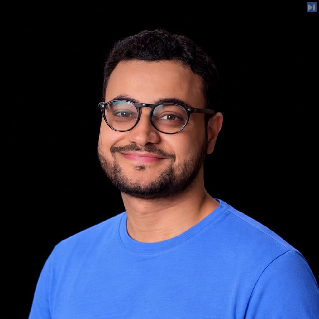 Head-and-shoulders portrait of Pedro Lopez against a black background.
