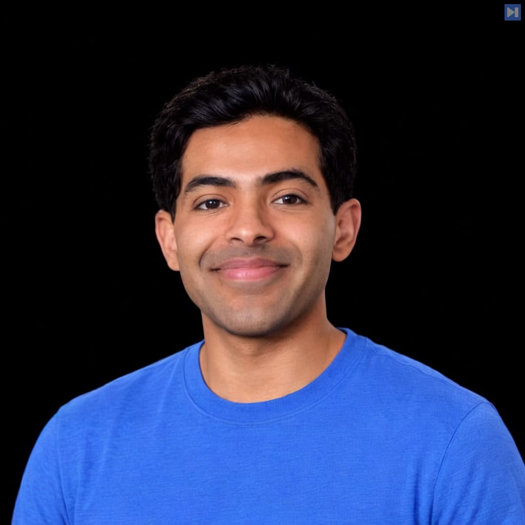 Head-and-shoulders portrait of Prathik Naidu against a black background.