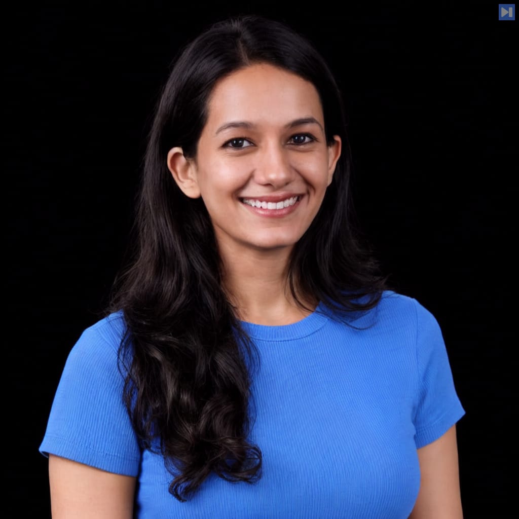Head-and-shoulders portrait of Preetika Bhateja against a black background.