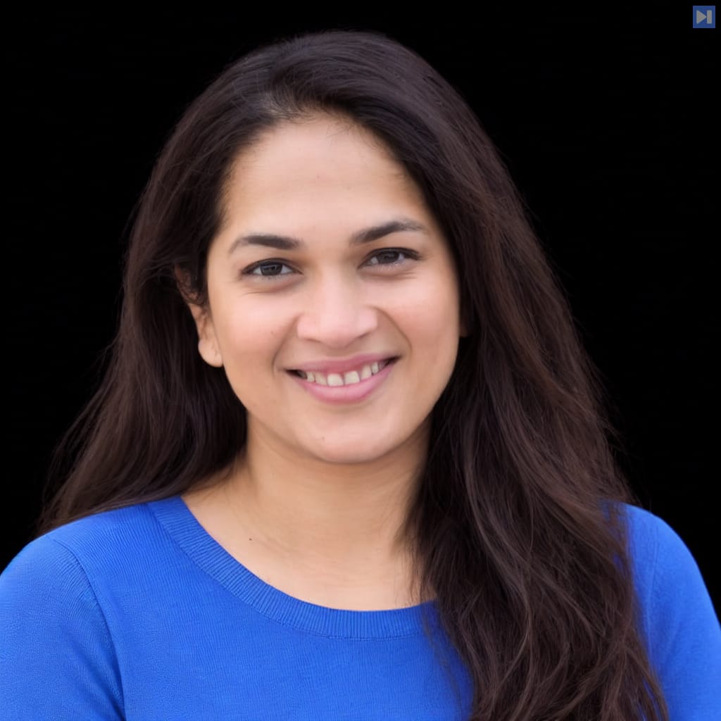 Head-and-shoulders portrait of Priyanka Phatak against a black background.