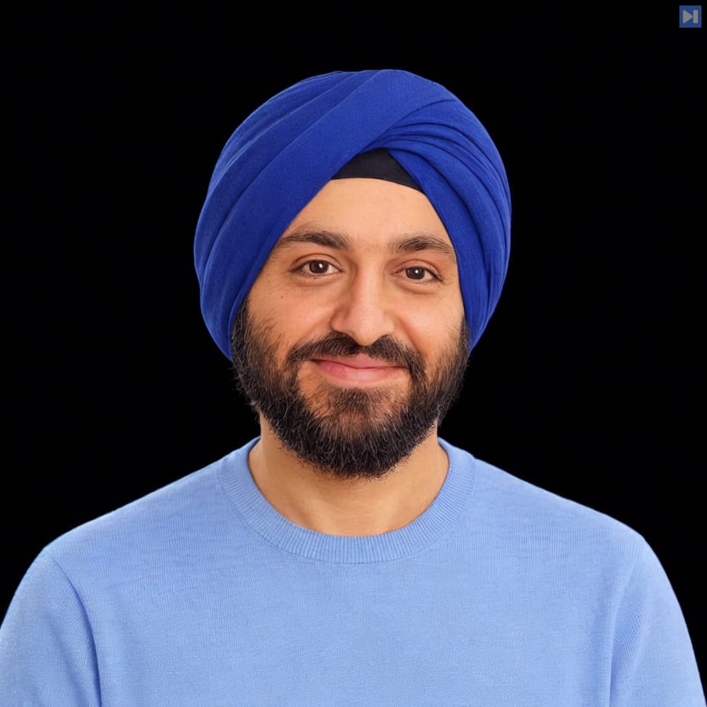 Head-and-shoulders portrait of Pushmeet Kohli against a black background.