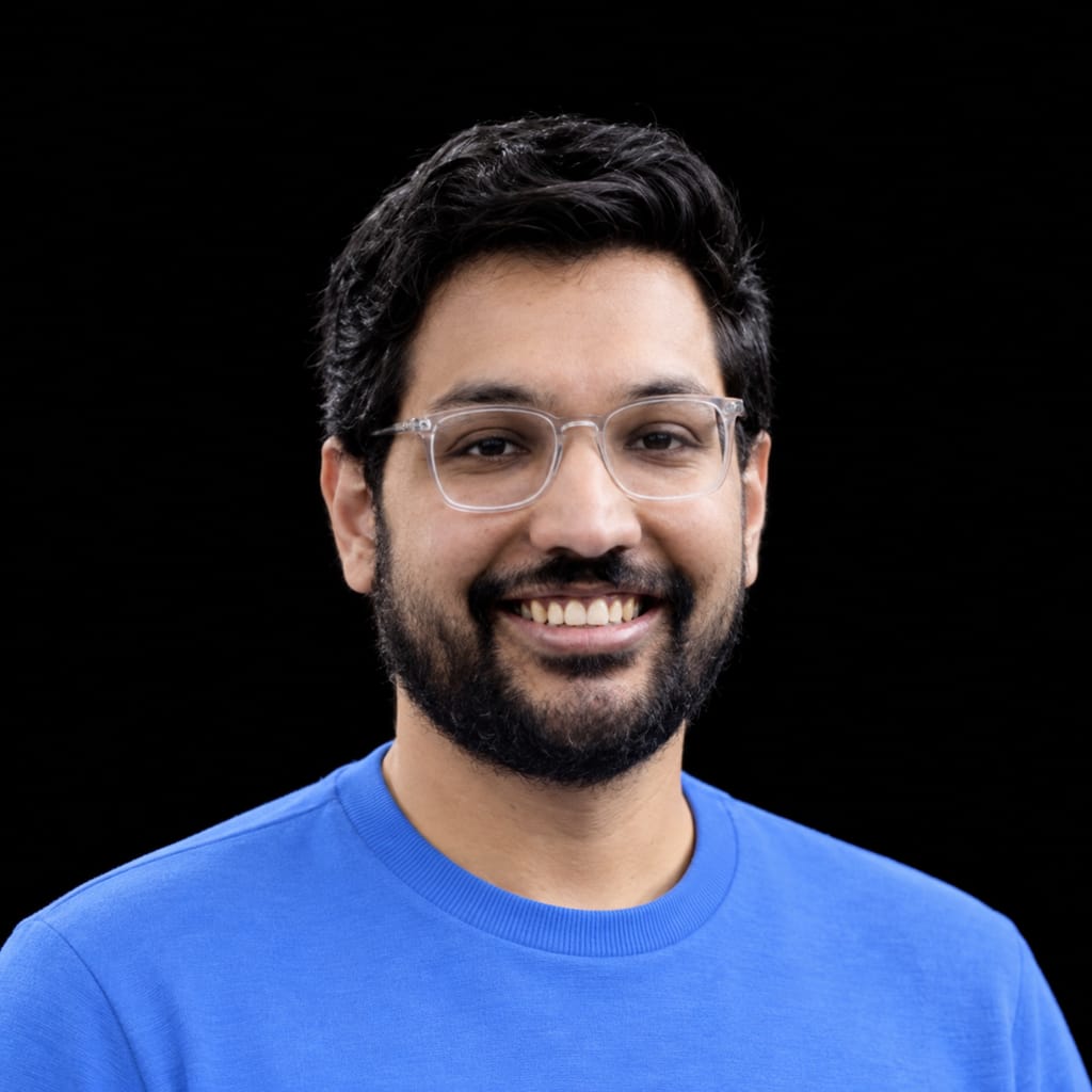Head-and-shoulders portrait of Raghav Saboo against a black background.