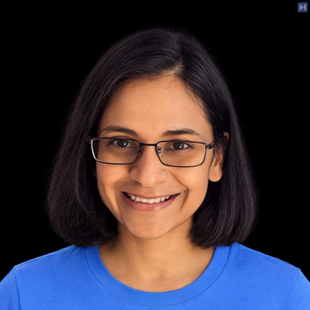 Head-and-shoulders portrait of Rajashree Agrawal against a black background.