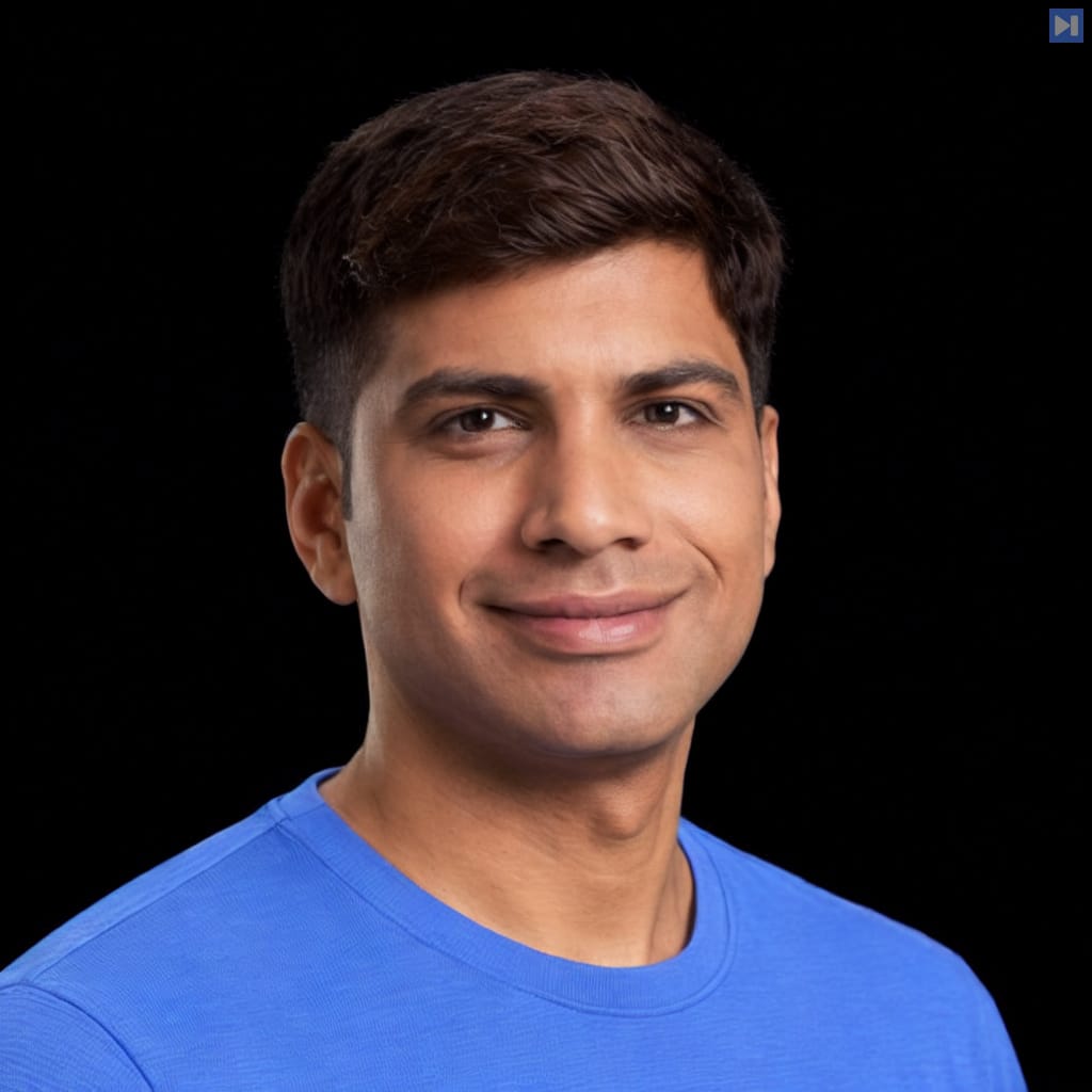 Head-and-shoulders portrait of Ravi Madabhushi against a black background.