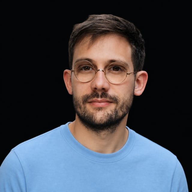 AI-generated portrait of Rémi Louf wearing an AI Videos-blue top against a black background.
