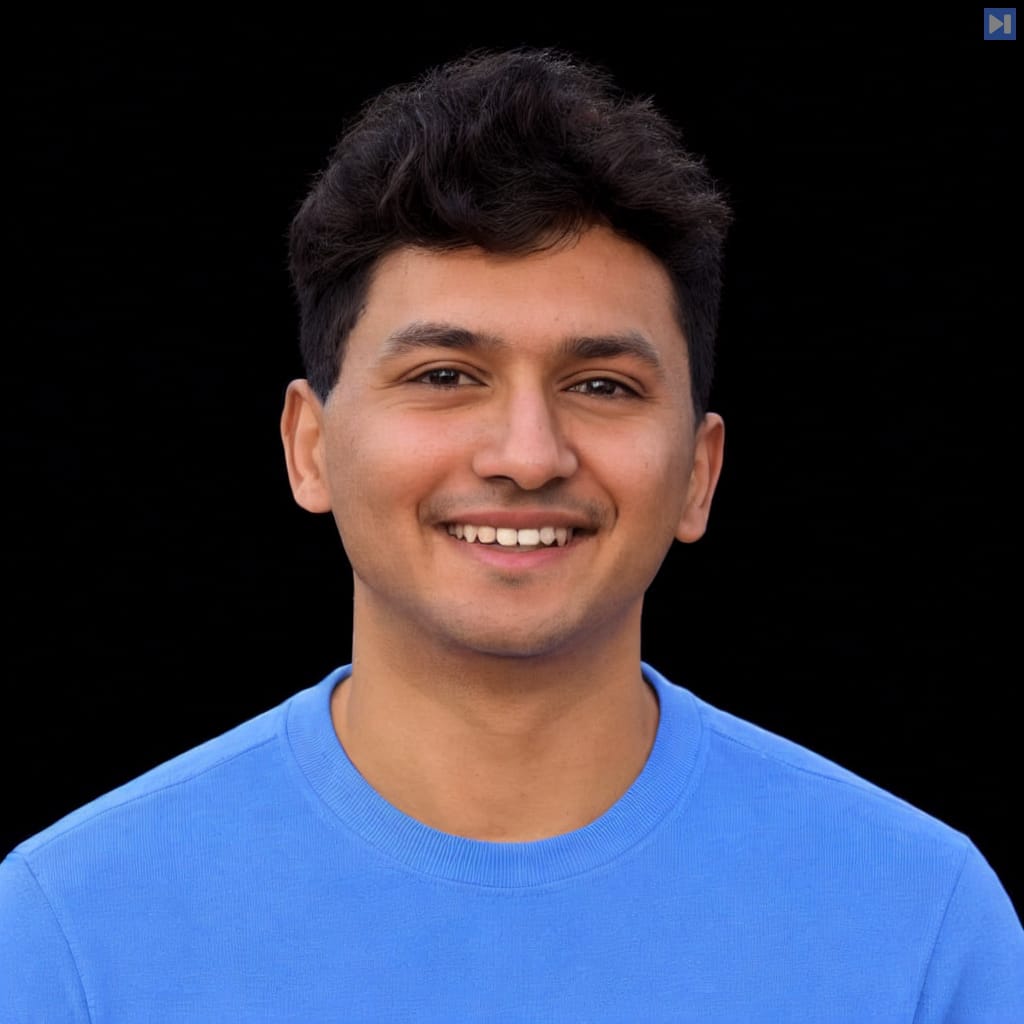 Head-and-shoulders portrait of Rishi Desai against a black background.