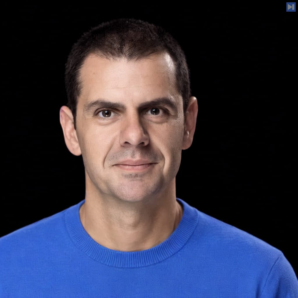 Head-and-shoulders portrait of Romain Huet against a black background.