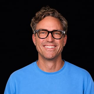 AI-generated portrait of Ryan Carson wearing an AI Videos-blue top against a black background.