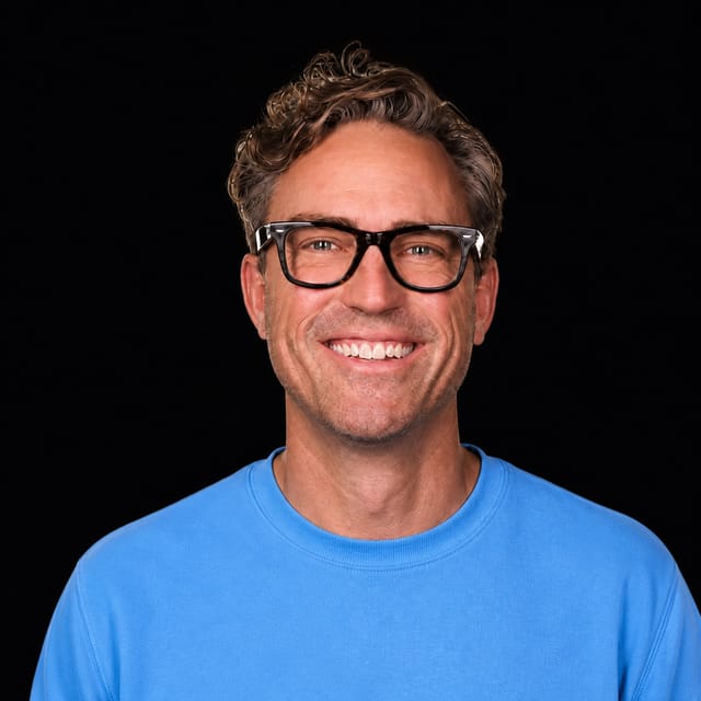 AI-generated portrait of Ryan Carson wearing an AI Videos-blue top against a black background.