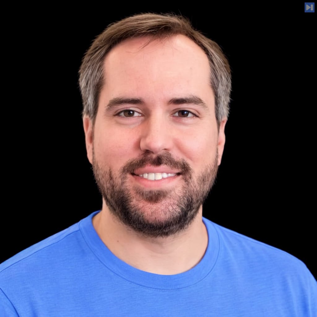 Head-and-shoulders portrait of Ryan Cooke against a black background.