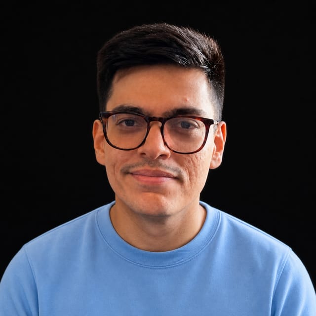AI-generated portrait of Sachin Malhotra wearing an AI Videos-blue top against a black background.