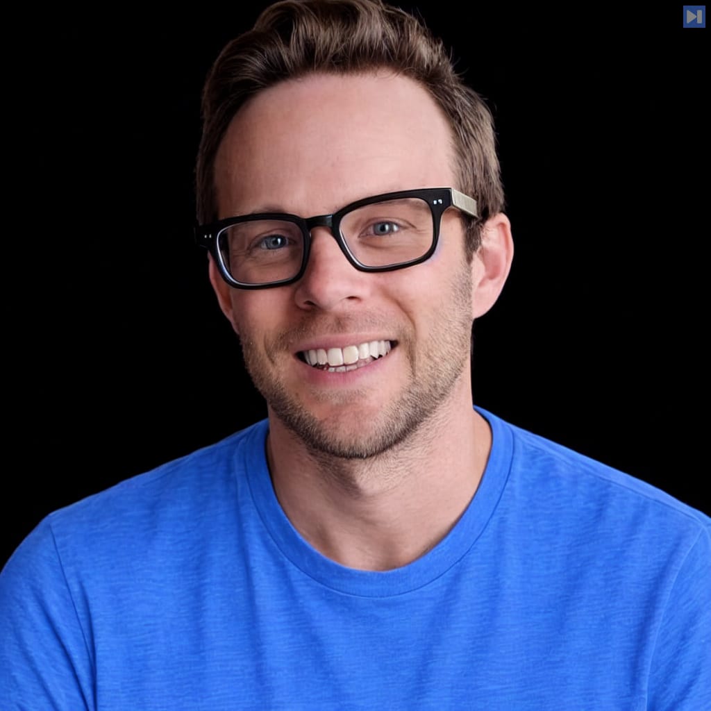 Head-and-shoulders portrait of Scott Tolinski against a black background.