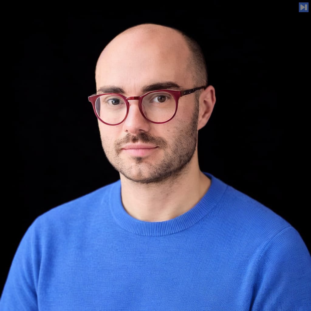Head-and-shoulders portrait of Séb Krier against a black background.