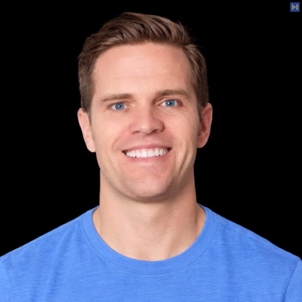 Head-and-shoulders portrait of Shane Wolf against a black background.