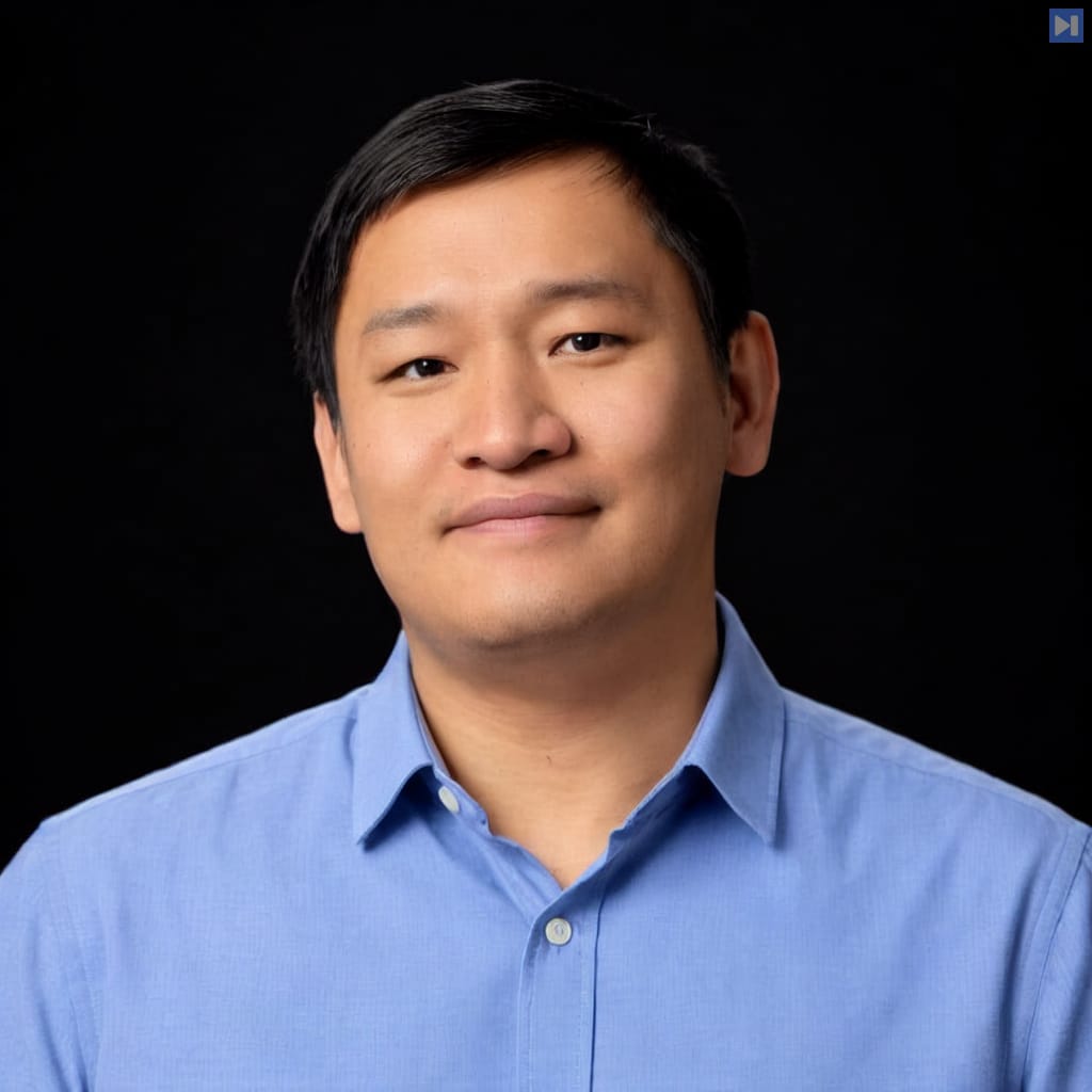 Head-and-shoulders portrait of Shawn Wen against a black background.