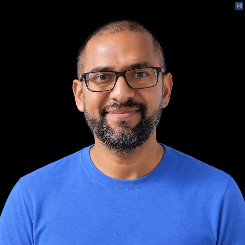 Head-and-shoulders portrait of Sitanshu Gupta against a black background.