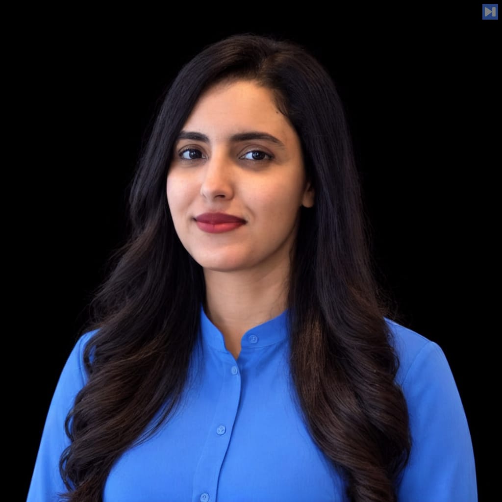 Head-and-shoulders portrait of Soukaïna Abelhad against a black background.