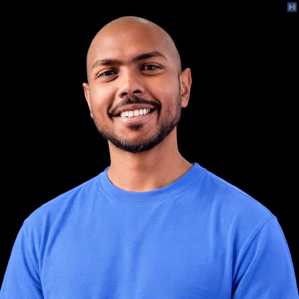 Head-and-shoulders portrait of Tejas Kumar against a black background.