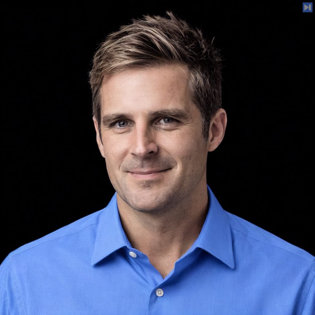 Head-and-shoulders portrait of Tim Ainge against a black background.