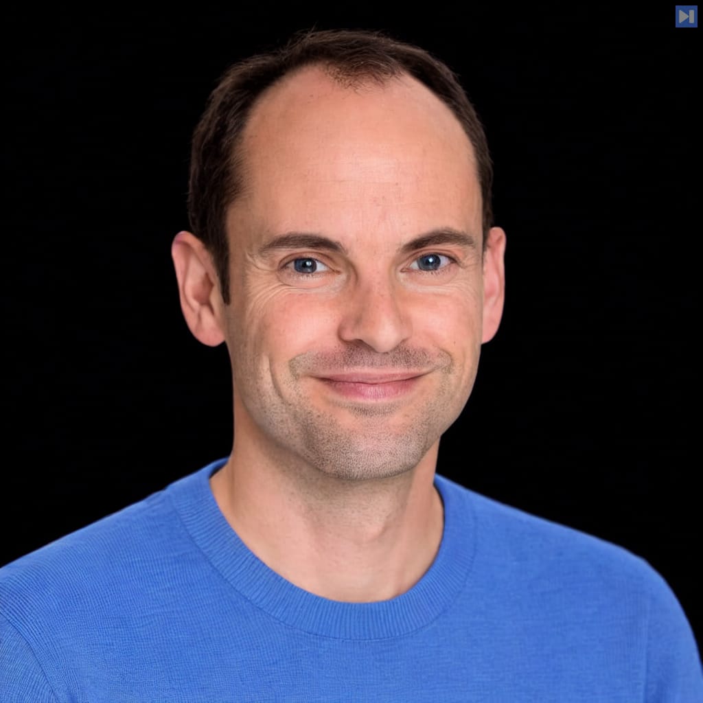 Head-and-shoulders portrait of Toby Ord against a black background.