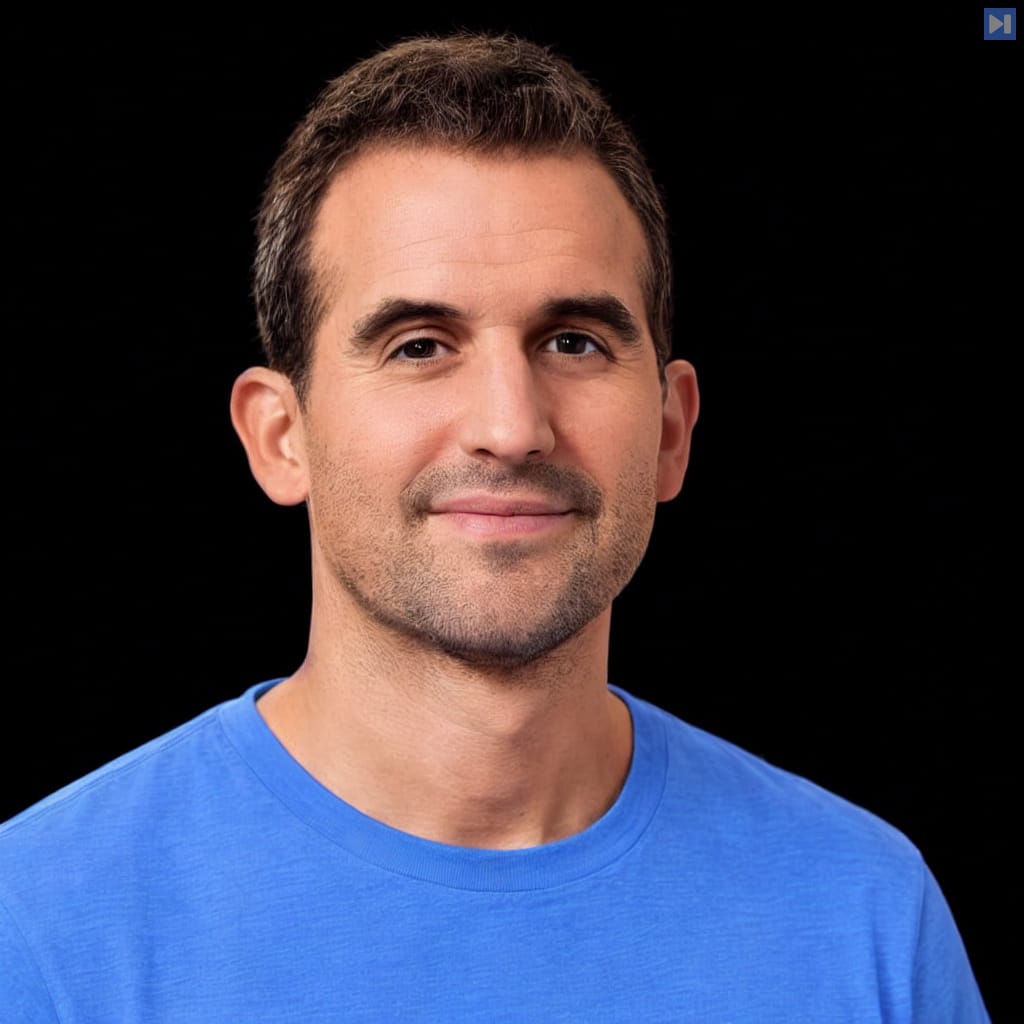 Head-and-shoulders portrait of Tom Brown against a black background.