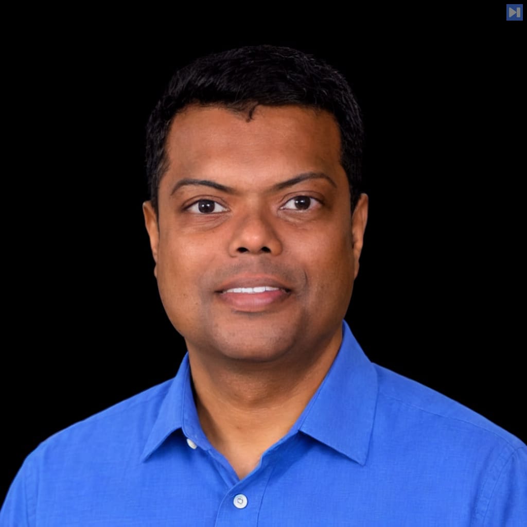 Head-and-shoulders portrait of Viren Baraiya against a black background.