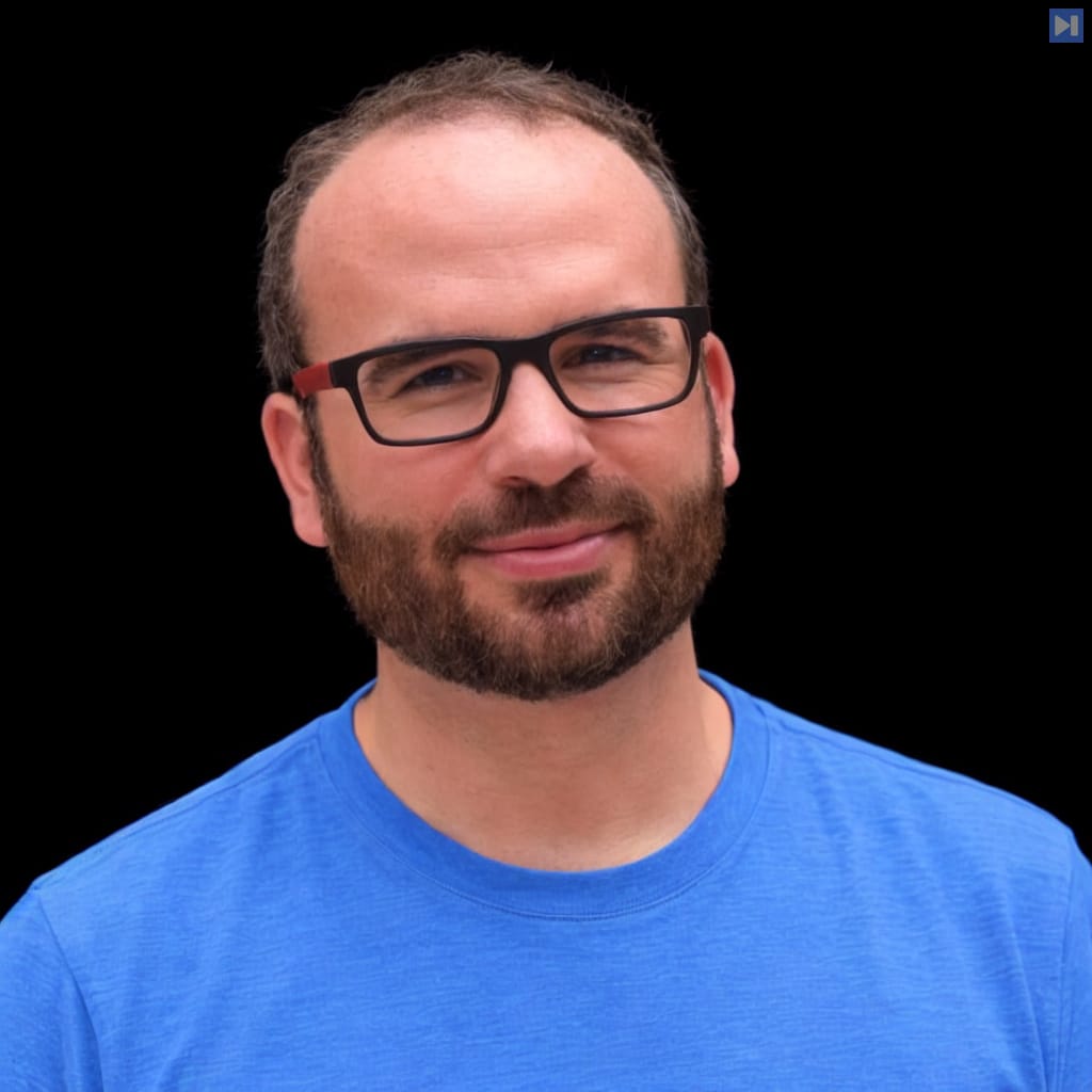 Head-and-shoulders portrait of Will Lyon against a black background.