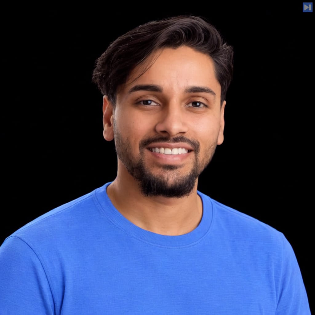 Head-and-shoulders portrait of Yohan Raju against a black background.