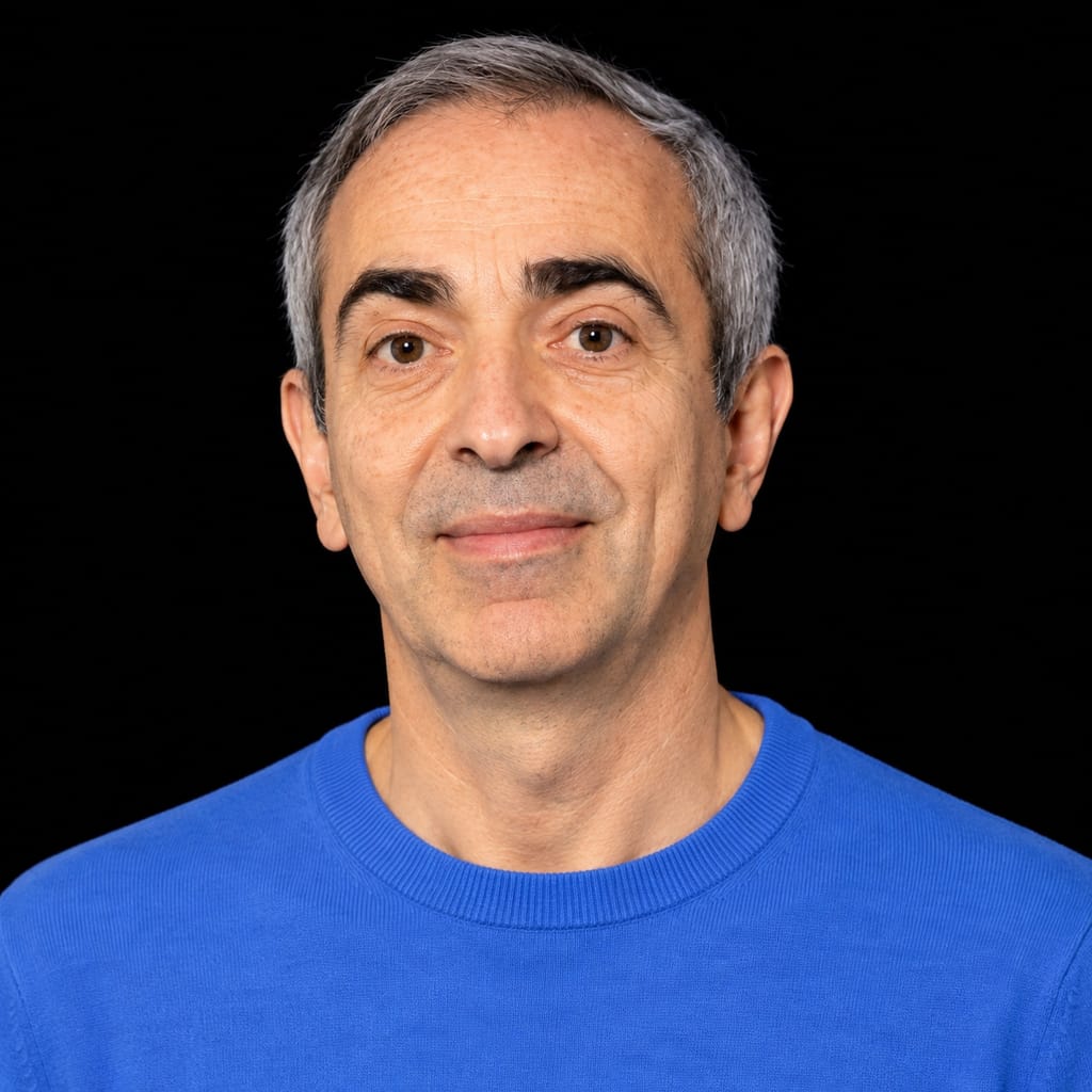 Head-and-shoulders portrait of Yves Raimond against a black background.